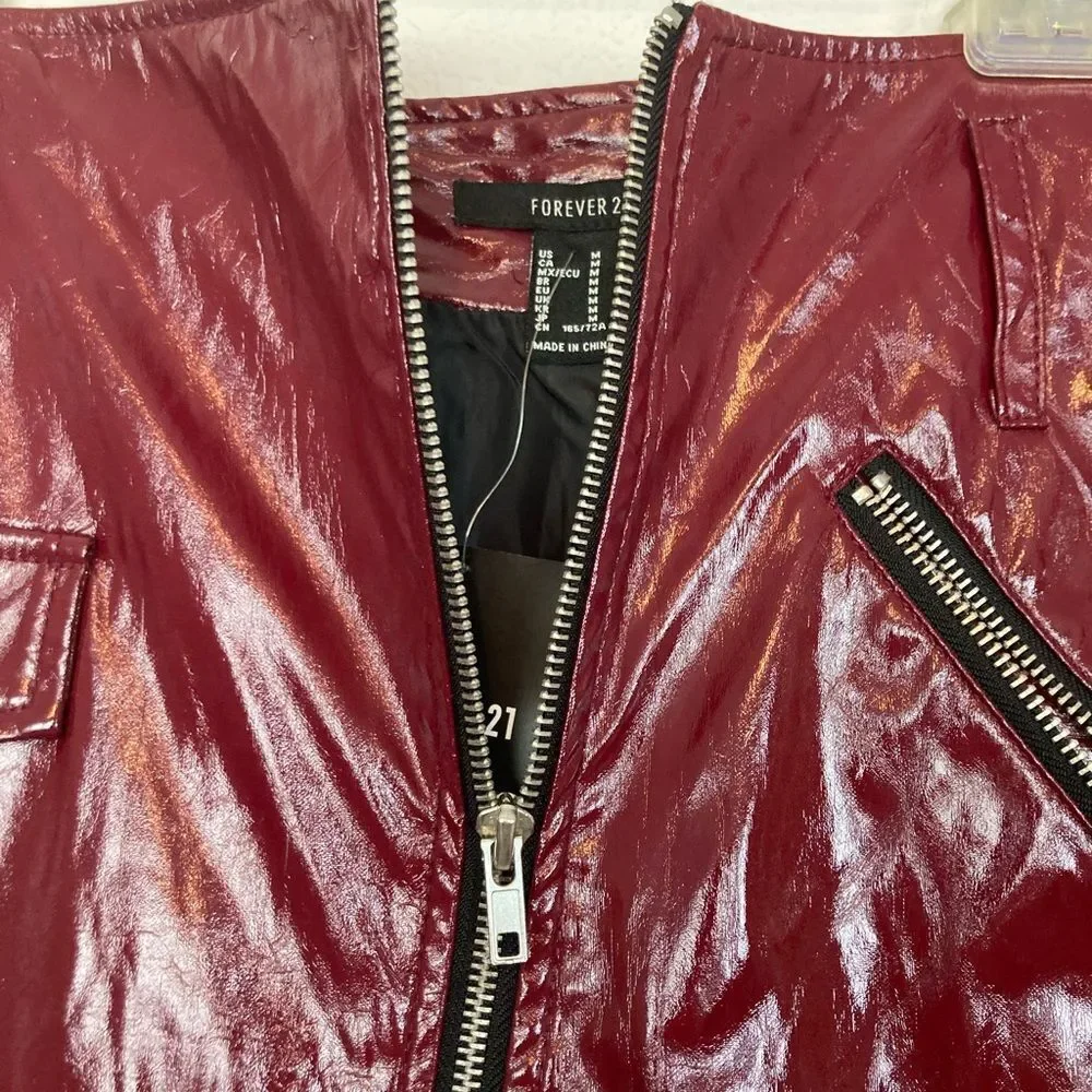 NWT Last Call Burgundy shiny Faux Leather Mini Skirt with Zip front & pocket